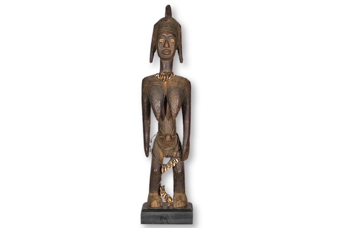 Female Bamana statue with cowrie shell eyes