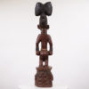 This statue was carved in the style of an Ose Sango (Oshe Shango) by the Yoruba people of Nigeria. Ose Sango figures represent the thunder god, Sango. The statue measures 39.5 inches tall and weighs 19 pounds. There is some cracking and wear and tear throughout - please inspect photos.